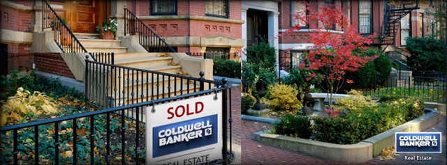row of nicely-landscaped townhomes, one with a Coldwell Banker SOLD sign on it